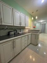 Superior Apartment, Courtyard View | Private kitchen | Full-size fridge, microwave, oven, cookware/dishes/utensils