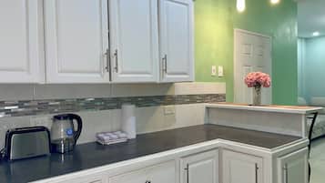 Superior Apartment, Courtyard View | Private kitchen | Full-sized fridge, microwave, oven, cookware/dishes/utensils
