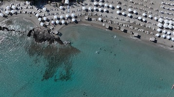 On the beach, white sand, free beach cabanas, sun-loungers