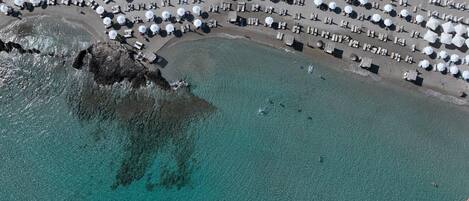 On the beach, white sand, free beach cabanas, sun-loungers