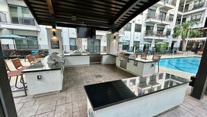 An outdoor pool area with a bar and seating.