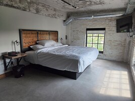 Deluxe Suite, River View | Memory foam beds, in-room safe, individually furnished, free WiFi