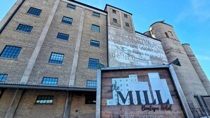 A hotel sign with the name 'The Mill' and address '309 W. Stanton Ave.' - The Mill Hotel (Fergus Falls)