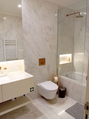 Shower, hair dryer, towels, soap