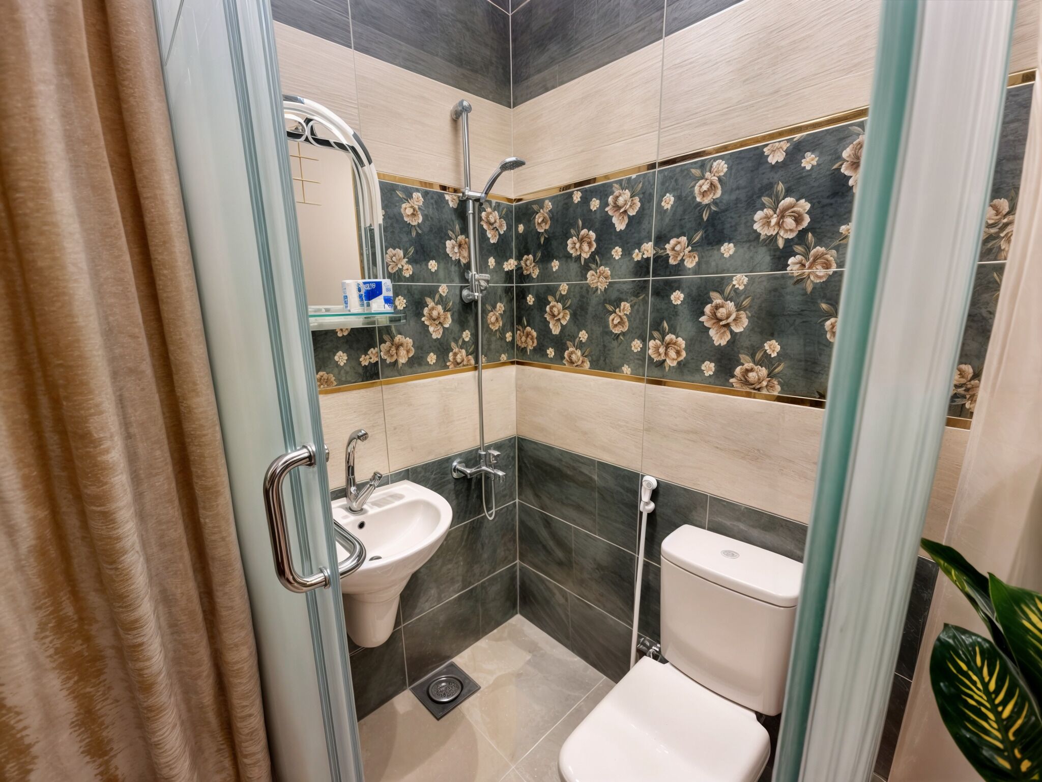 A bathroom with a glass shower enclosure, a sink, and a toilet.