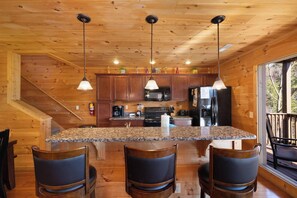 Fridge, dishwasher, coffee/tea maker, cookware/dishes/utensils