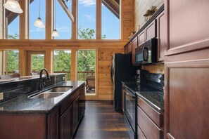 Fridge, dishwasher, coffee/tea maker, cookware/dishes/utensils