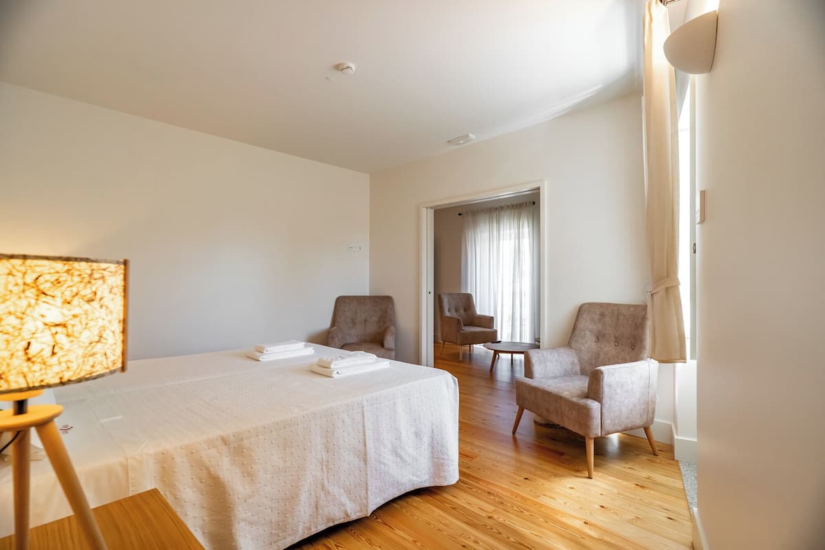 Deluxe Suite, Private Bathroom, Pool View | 1 bedroom, desk, laptop workspace, free WiFi