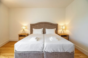 Deluxe Suite, Private Bathroom, Pool View | 1 bedroom, desk, laptop workspace, free WiFi