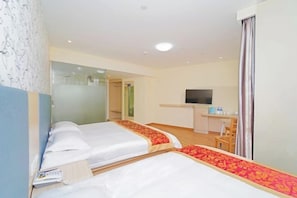 A hotel room with two beds, a desk, a TV, and a bathroom. - Yuntu Hotel (Shanghai Jinshan Bailian City Beach) (Shanghai)