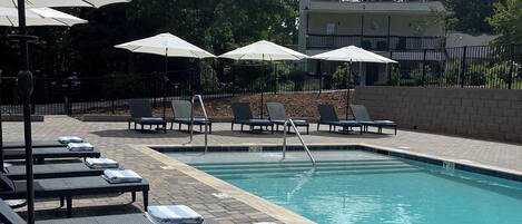 Outdoor pool, open 9:00 AM to 8:00 PM, pool umbrellas, pool loungers