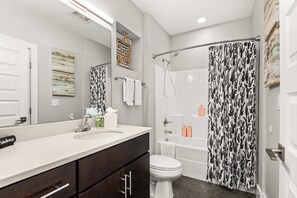 Shower, hair dryer, towels, shampoo