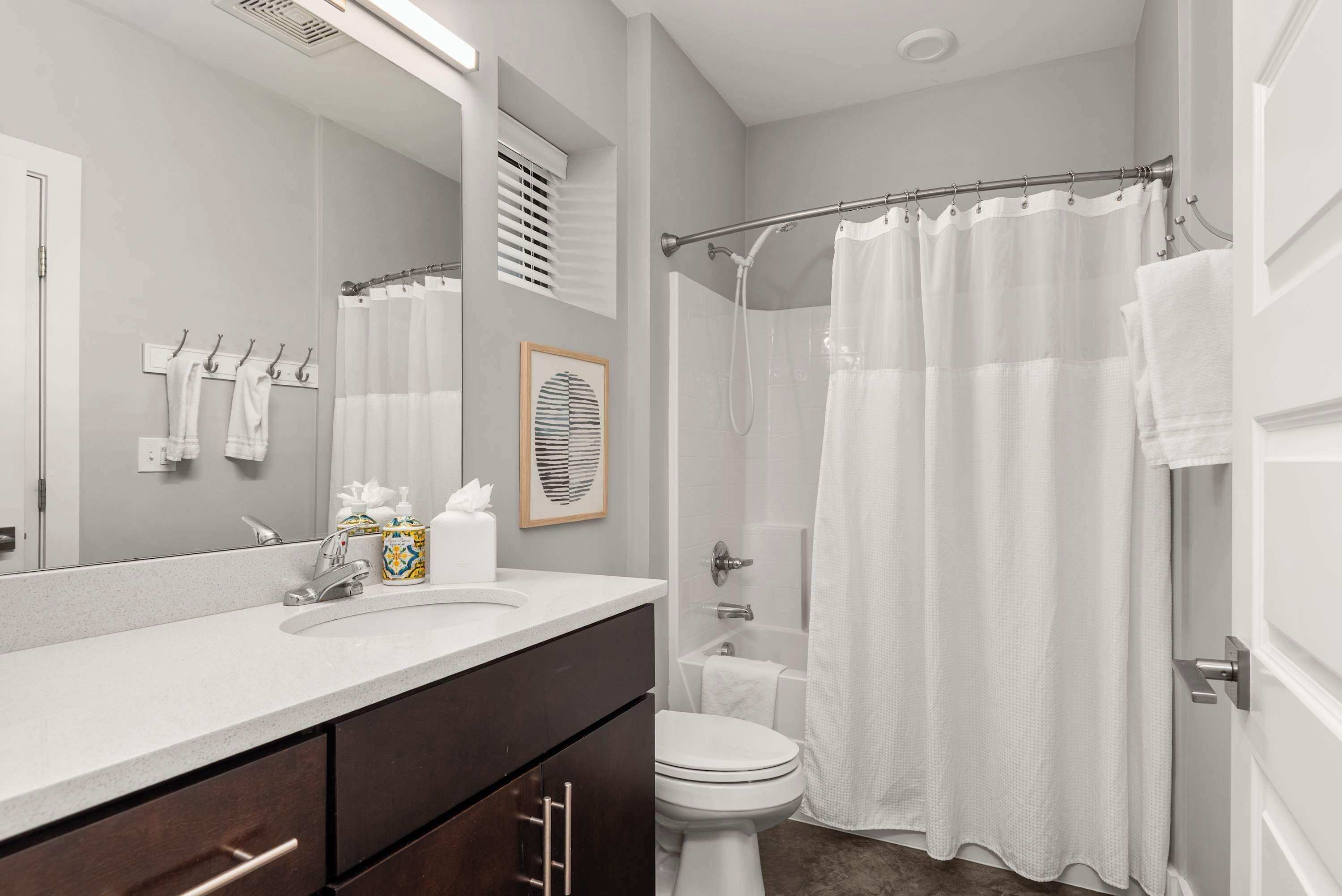Shower, hair dryer, towels, shampoo