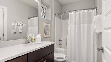 Shower, hair dryer, towels, shampoo