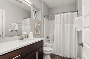 Shower, hair dryer, towels, shampoo