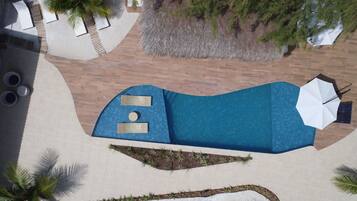 Outdoor pool, free cabanas, pool umbrellas