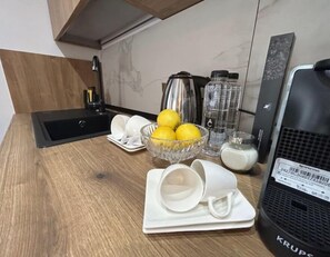 Microwave, oven, coffee/tea maker, cookware/dishes/utensils