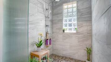 Shower, towels, soap, toilet paper