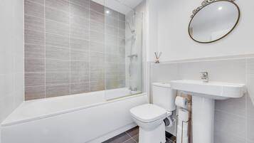 Shower, towels, soap, toilet paper
