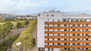 A multi-story building with a modern design, featuring balconies and a flat roof. - Stylish Stay in Lisbon-Scenic Views (Lisbon)