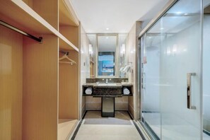 A modern bathroom with a glass shower enclosure, a vanity with a marble countertop, and a large mirror above the sink. - Vienna Classic Hotel (Hefei Shushan) (Hefei)