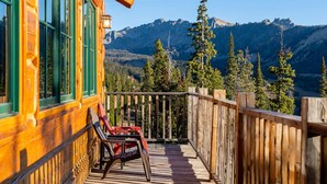 A wooden deck with a view of mountains. - Luxury Mountaintop Retreat | 360° Views + Private Hot Tub, 10 min from Big Sky Resort (Big Sky)