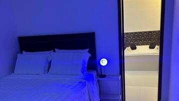 Deluxe Suite, Courtyard View | Blackout drapes, iron/ironing board, free WiFi