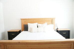Cozy retreat with a comfortable bed and two bedside tables.
