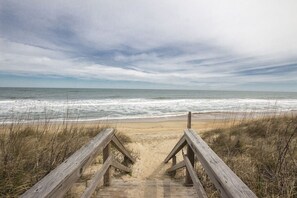 A wooden boardwalk leading to a beach with ocean views. - Duck, NC - Oceanfront and Unlimited Sunrises!  Welcome to Sandy Quacks! (Kitty Hawk)