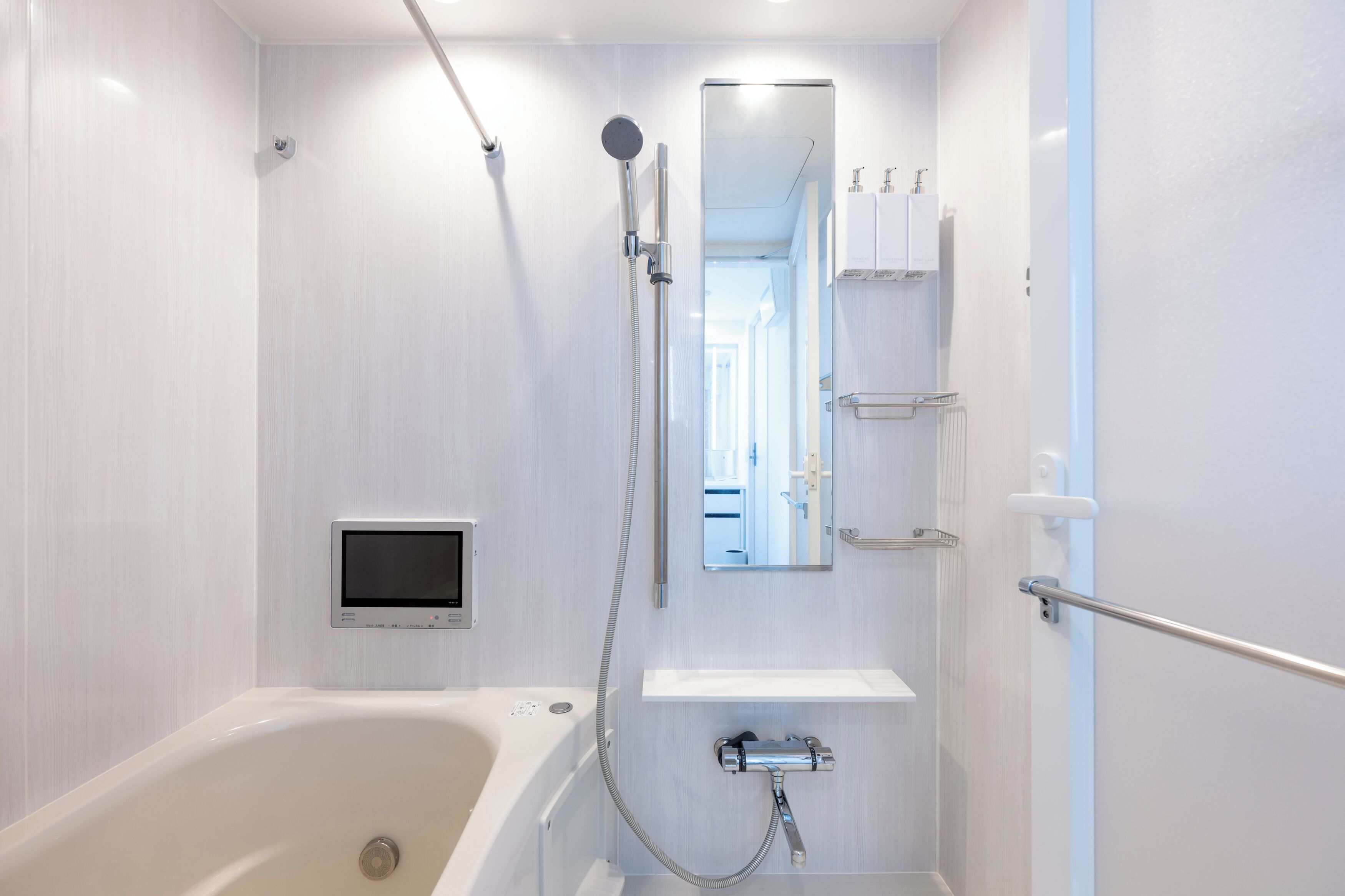 Separate bathtub and shower, free toiletries, hair dryer, slippers