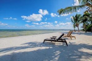 On the beach, sun loungers, beach towels