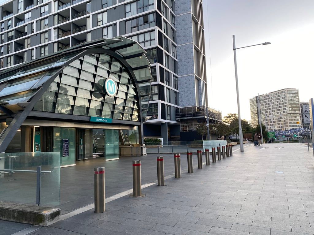 A modern building with a glass facade and a sign reading 'North Hyde.'