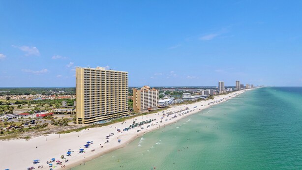 A coastal hotel with multiple floors, a beachside location, and a view of the ocean. - Beachfront Condo w/ Ocean Views + Pool Access + Beach Gear Emerald Isle 808 by Avantstay (Panama City Beach)