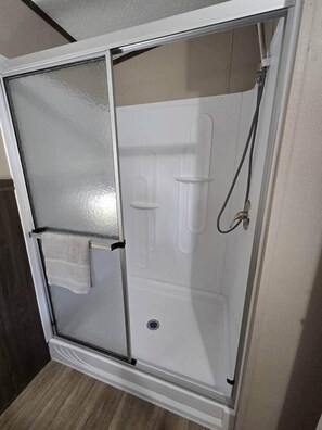 Shower, hair dryer, towels, soap