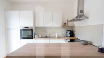 Fridge, oven, cookware/dishes/utensils