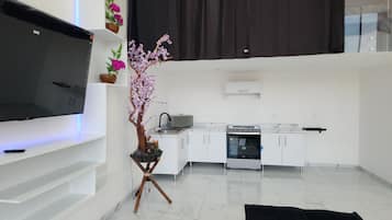 Departamento Deluxe, vista a la ciudad | 1 habitación, ropa de cama de alta calidad y edredón