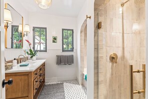 Shower, hair dryer, towels, soap