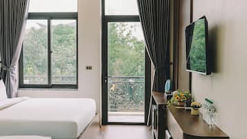 Deluxe Quadruple Room, Non Smoking, Balcony | Desk, laptop workspace, blackout drapes, soundproofing