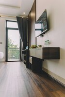 Deluxe Quadruple Room, Non Smoking, Balcony | Desk, laptop workspace, blackout drapes, soundproofing