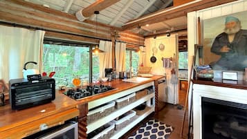 Microwave, coffee/tea maker, cookware/dishes/utensils, dining tables