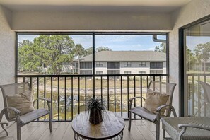 Enjoy a peaceful retreat with a balcony offering a view of the surrounding area.
