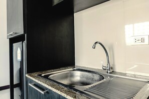 Deluxe Room, Kitchen, Partial Sea View | Private kitchenette | Microwave, electric kettle