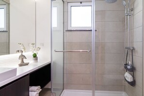 Shower, hair dryer, towels, soap