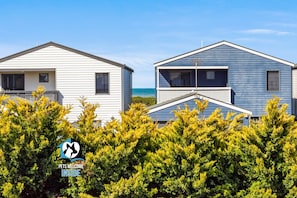 Two mobile homes with a clear view of the ocean in the background. - 3 Glen Allen Road, Middleton - Massive Middleton Coastal Home with Next-Level Arcade+Games Room (Middleton)
