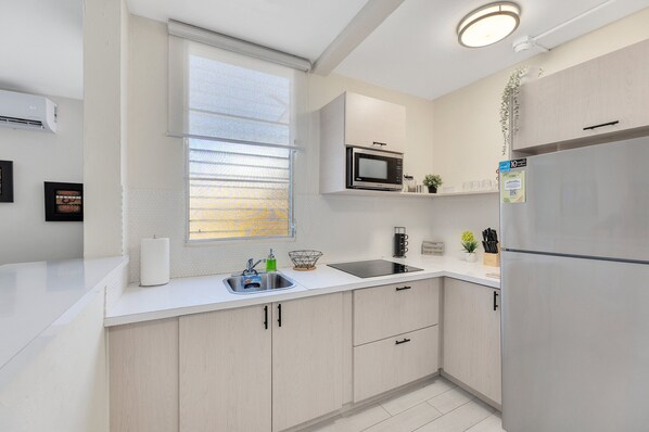 Fridge, microwave, coffee/tea maker, toaster