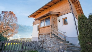 A wooden chalet with a stone foundation, a wooden staircase, and a view of mountains. - Chalet in Fügen near Spieljoch Ski Lift (Fügen)