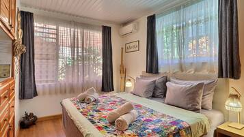 2 habitaciones, tabla de planchar con plancha y ropa de cama