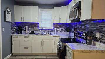 Fridge, microwave, oven, cookware/dishes/utensils