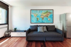 Deluxe Apartment, Patio, Garden View | Living area | 32-inch flat-screen TV with digital channels