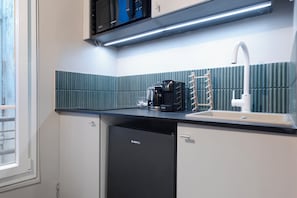 Fridge, microwave, stovetop, coffee/tea maker